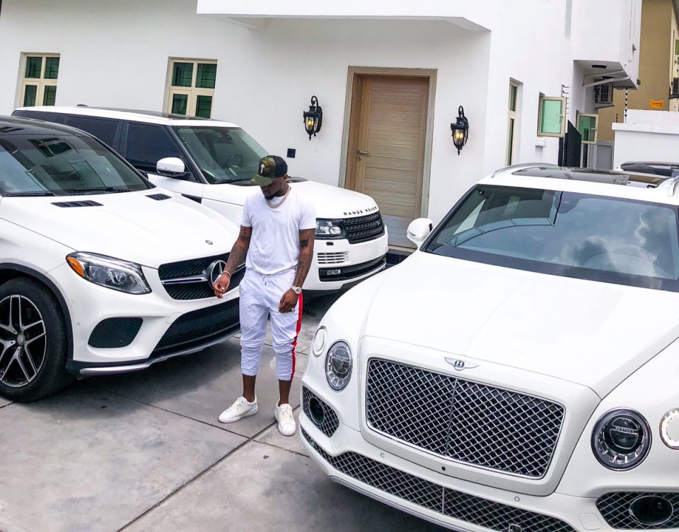 Afro-pop singer and FIA crooner, David Adeleke who is popularly known as Davido in a latest Instagram post, shows off his impressive all-white luxury garage, with him also at the background spotting an all-white outfit to match with his house fitting in as well.lol...even his generator house is white! lol