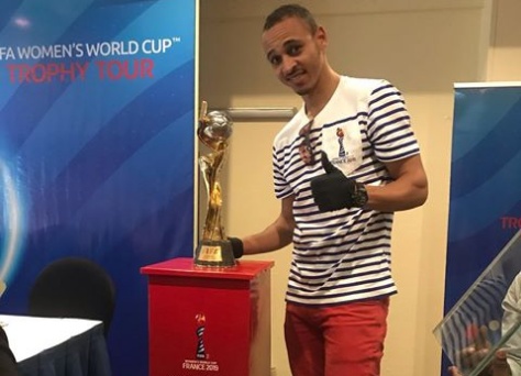 Osaze Odemwingie shows off the FIFA Women's World Cup trophy