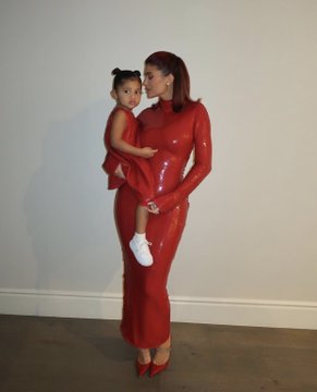 Kylie Jenner And Daughter Twinning In Red Outfit At Christmas Party
