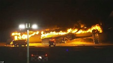 Japan Airlines Flight Catches Fire On Runway At Tokyo's Haneda Airport After Collision
