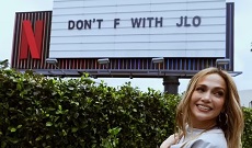 Jennifer Lopez Poses With 'Don't F With JLo' Billboard