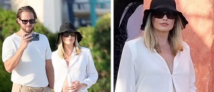 Margot Robbie Cradles Her Growing Bump In A White Unbuttoned Shirt As She Steps Out With Tom Ackerley In Sardinia